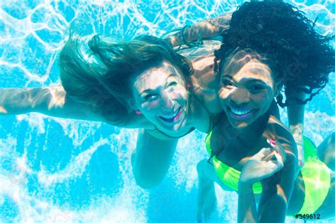 Friends Diving Underwater In Swimming Pool Stock Photo 549612