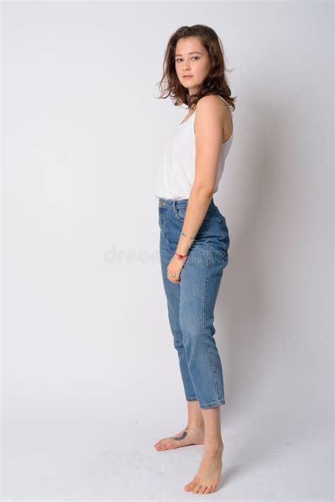 Full Body Shot Of Young Beautiful Woman Standing And Posing Stock Photo