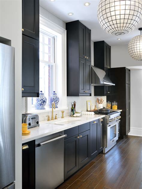 It blends so beautifully with those moody cabinets. Dark Cabinets White Appliances | Houzz
