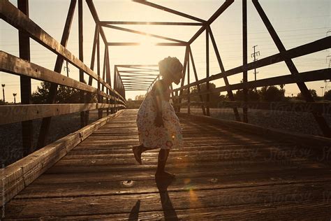 African American Girl Dancing On Wodden Bridge By Stocksy Contributor Dina Marie Giangregorio