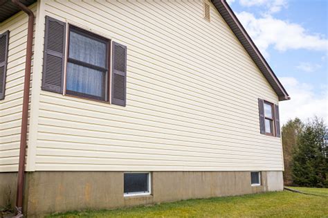 House With Pale Yellow Vinyl Siding Stock Photo Download Image Now