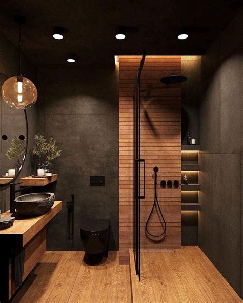 A Modern Bathroom With Wooden Floors And Black Walls Along With An