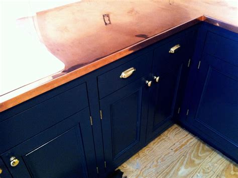 Some people are putting in full blue kitchens. Architectural Details » Navy Blue and Copper Kitchen ...