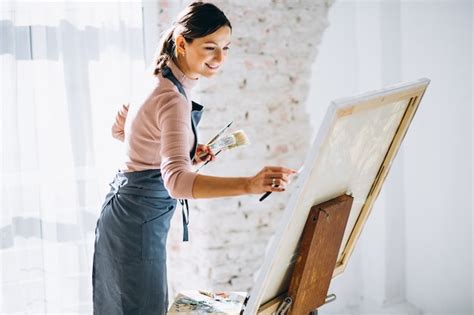 Free Photo Female Artist Painting In Studio