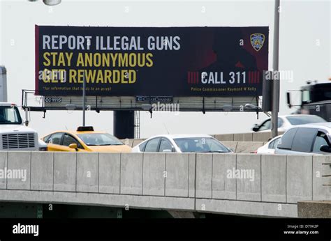 Brooklyln, NY USA // Cars wait in traffic under the NYC billboard to