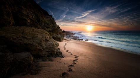 Nature Landscape Sea Coast Sand Footprints Rock Sun Clouds