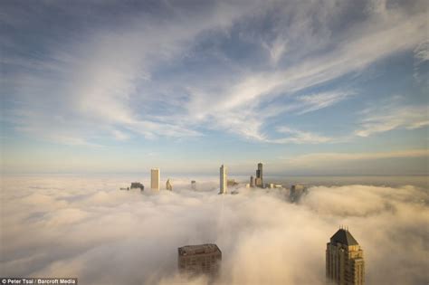 Stunning Images Of Chicago Skyscrapers Piercing Through Clouds As City