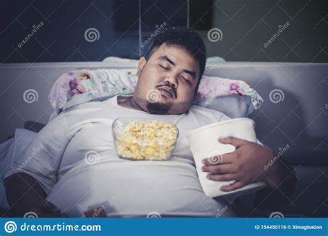 Fat Man Sleeping With Junk Foods On The Bed Stock Photo Image Of