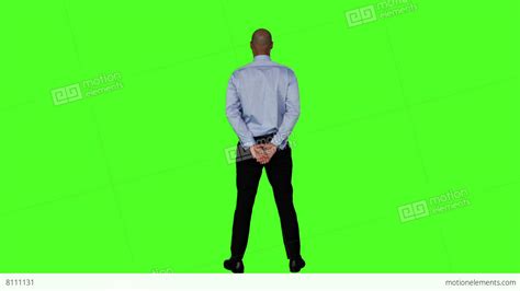Businessman Standing With Hands Behind Back Stock Video Footage 8111131