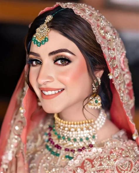 Kinza Hashmi Looks Ravishing In Peach And Red Bridal Jora Lens