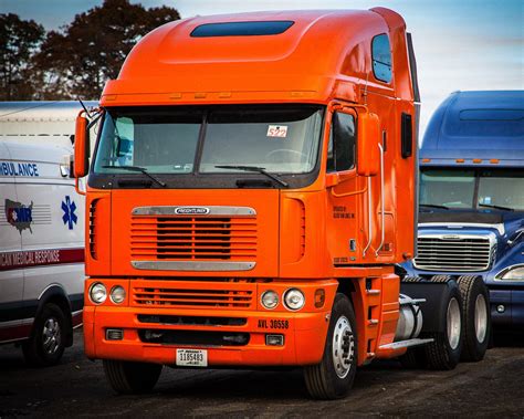 Pumpkin colored Freightliner Argosy. #Trucking #Freightliner
