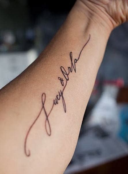 A great tattoo that is made memorable by adding the name of a loved one. Arm Name Tattoo Ideas