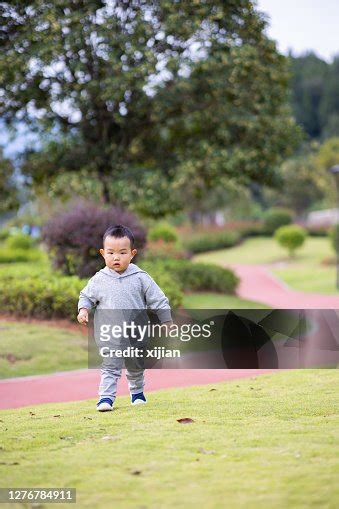 Baby Boys Playing And Walking In Park High Res Stock Photo Getty Images
