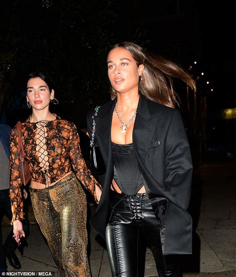 Dua Lipa Flaunts Her Cleavage In A Racy Tie Up Top As She Enjoys A