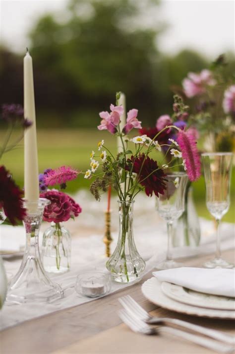 Clear Glass Bud Vases And Candlesticks For This Wedding Tablescape