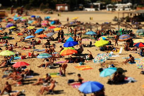 View Of Umbrellas And People On A Crowded Beach · Free Stock Photo