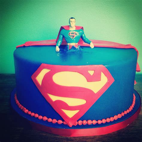 Superman Birthday Cake With A Superman Figure Busting Out The Top