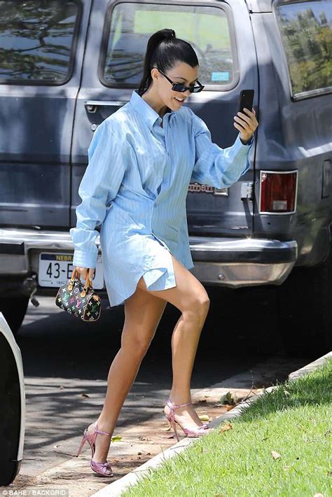 Kourtney Kardashian Shows Off Tanned And Toned Legs Beneath Unique Over Sized Shirt Turned