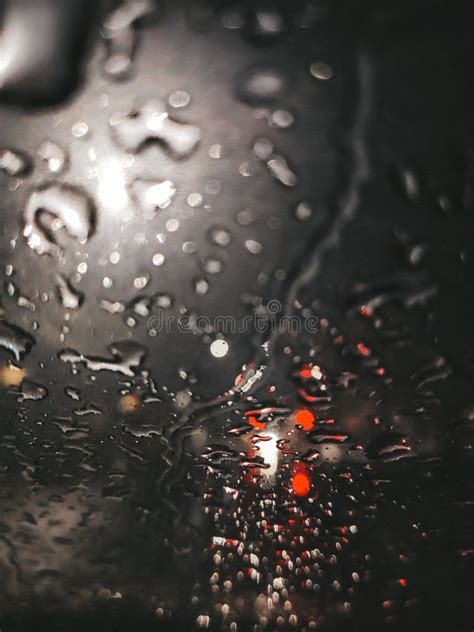 Rain Drops On Window With Road Light Bokeh Water Drop On The Glass