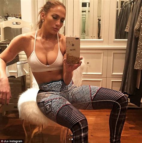 Jennifer Lopez Flaunts Her Cleavage And Flat Tummy In Revealing Sports Bra For Sexy Mirror