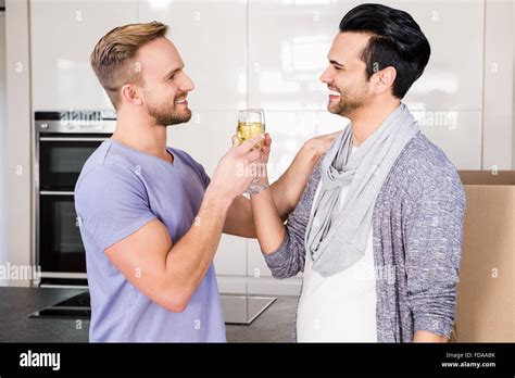 Smiling Gay Couple Toasting With Champagne Stock Photo Alamy