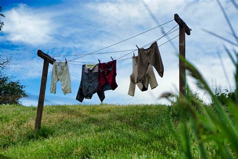 Clothes Hanging In Clothesline Photo Free Apparel Image On Unsplash