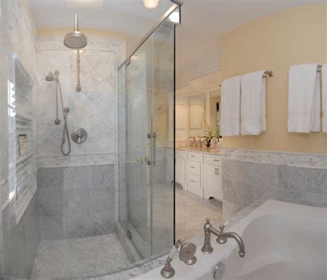 Less stark here because there is more white in the tile. Shower idea | White marble bathrooms, Carrara marble ...