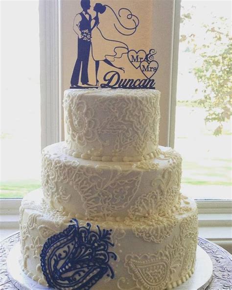Buttercream Wedding Cake With Hand Piped Pattern In White And A Pop Of