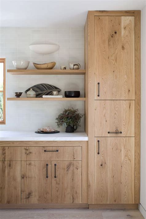 Blonde Wood Cabinets White Tile To The Ceiling Open Shelving