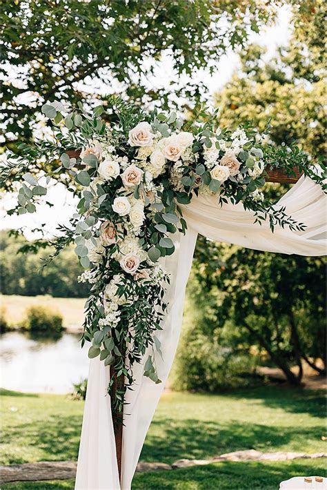 Gorgeous Outdoor Wedding Ceremony Arbor With Draping And Flowers