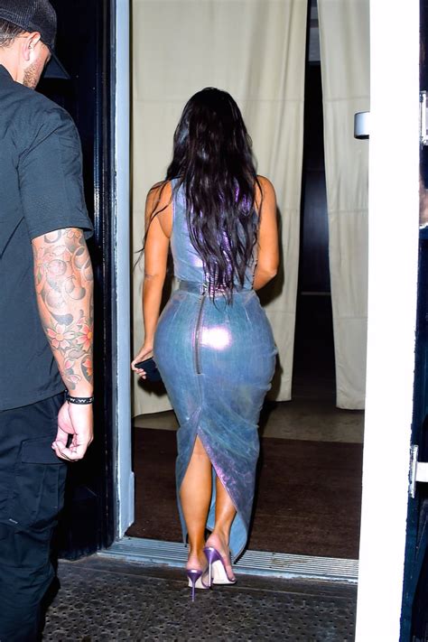 kim kardashian wearing an iridescent dress with kanye west at fgi s 2019 night of stars kim
