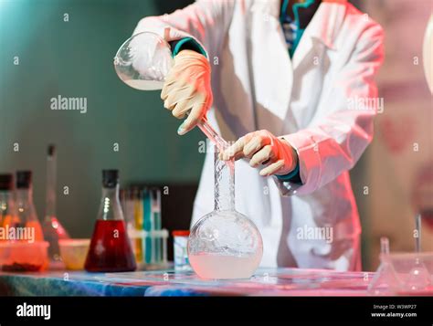 Experiments In A Chemistry Lab Conducting An Experiment In The