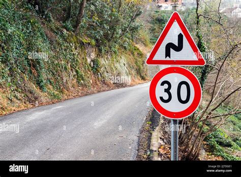 Dangerous Turns And Speed Limit Road Signs Mounted Near Turning