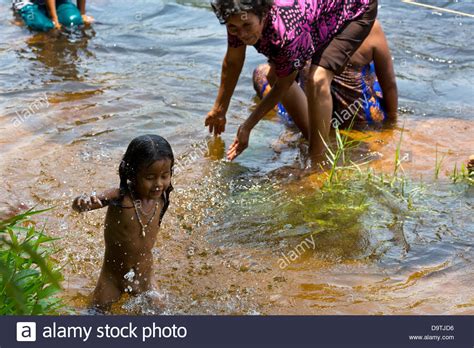 Local People Taking A Bath In The River At The Teuk Chhou Rapids In Stock Photo Alamy