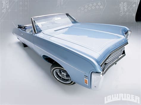 (lowrider) nice clean 1969 chevy impala 2 door (no engine or transmission) but otherwise it's complete car, chrome undercarriage, custom engraved door handles, mirrors, spinners and rear axle. 1969 Chevrolet Impala - Lowrider Magazine