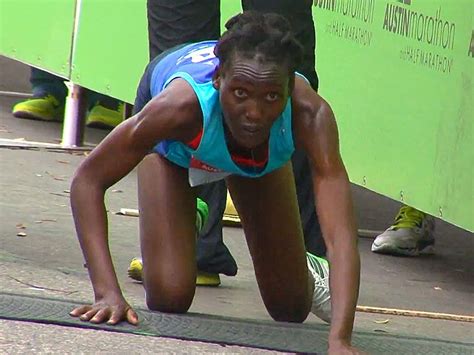 Kenyan Runner Crawls To The Finish Line At The Austin Marathon PHOTO Marathon Photo