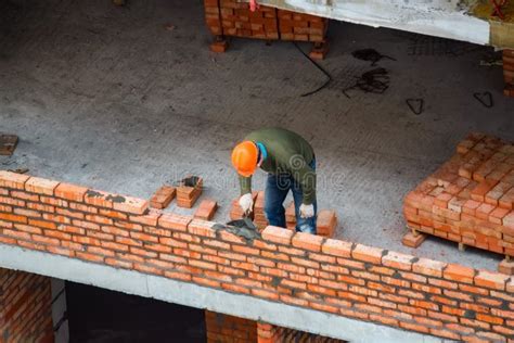 View Of Mason Laying Bricks At Construction Site Stock Photo Image Of