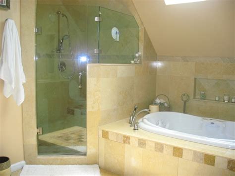 An in wall niche helps keep soaps and shampoos off the shower floor and keeps things this tub to shower conversion features natural stone floor that flows through to a matching shower base. Shower & Jacuzzi tub - Mediterranean - Bathroom - New York ...