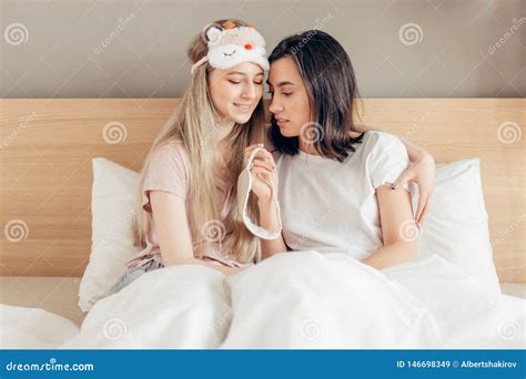 Attractive Lesbians Girls With Sleeping Masks Preparing To Go To Bed Stock Image Image Of Home