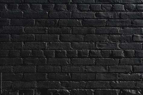 Old Brick Wall Painted Black By Kristin Duvall Wall Black Stocksy
