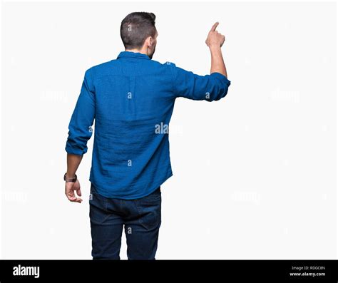Young Handsome Man Over Isolated Background Posing Backwards Pointing