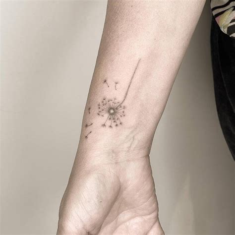 Fine Line Dandelion Tattoo Located On The Wrist