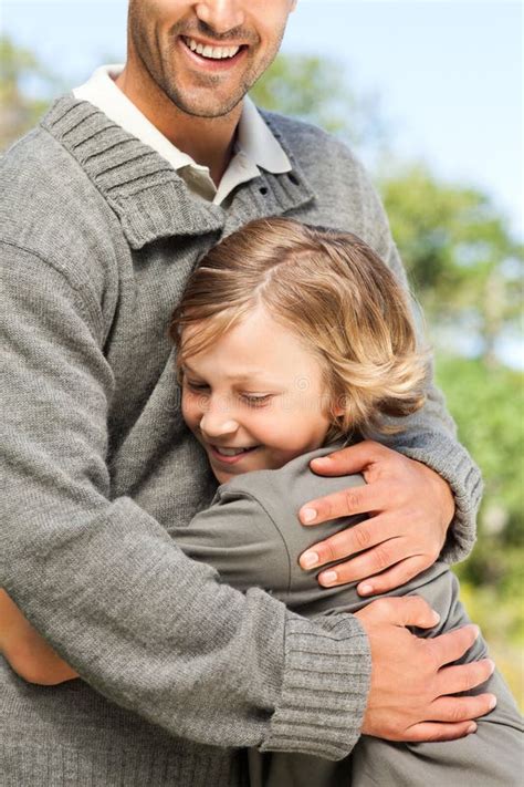 Son Embracing His Father Stock Photo Image Of Young 18740462