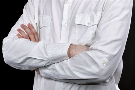 Male Hands In White Shirt Folded On His Chest Closeup Stock Photo