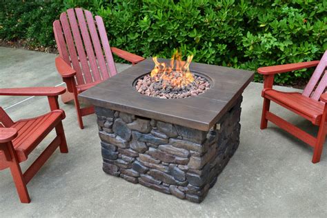 The fire tables come complete with lava rock filler and a matching lid for when the burner is not in use. Tortuga Outdoor Yosemite Faux Wood/Stone Propane Fire Pit ...