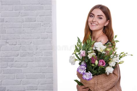 the girl embraced a bouquet of japanese roses against the white window stock image image of