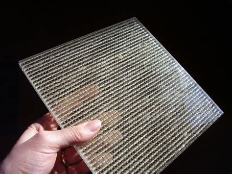 Architectural Mesh Laminated In Glass Allows Designer To Preserve The Beauty Of Raw Metals Such