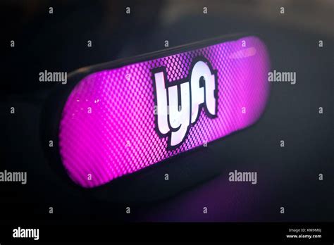 Illuminated Logo Of The Ridesharing Company Lyft On The Dashboard Of A
