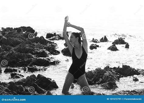 Beautiful Girl Is Posing On The Rocks And Stones At The Beach Stock Image Image Of Posing