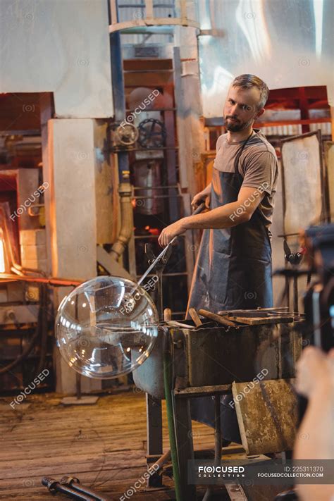 Glassblower Shaping A Glass On The Blowpipe At Glassblowing Factory — Working Hand Tool Stock